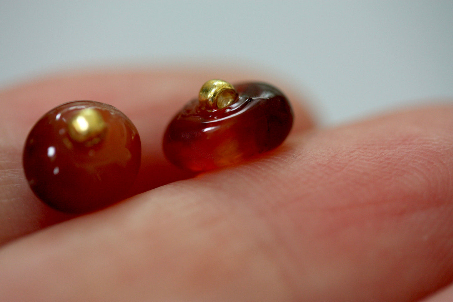 Small little orange glass stud earrings