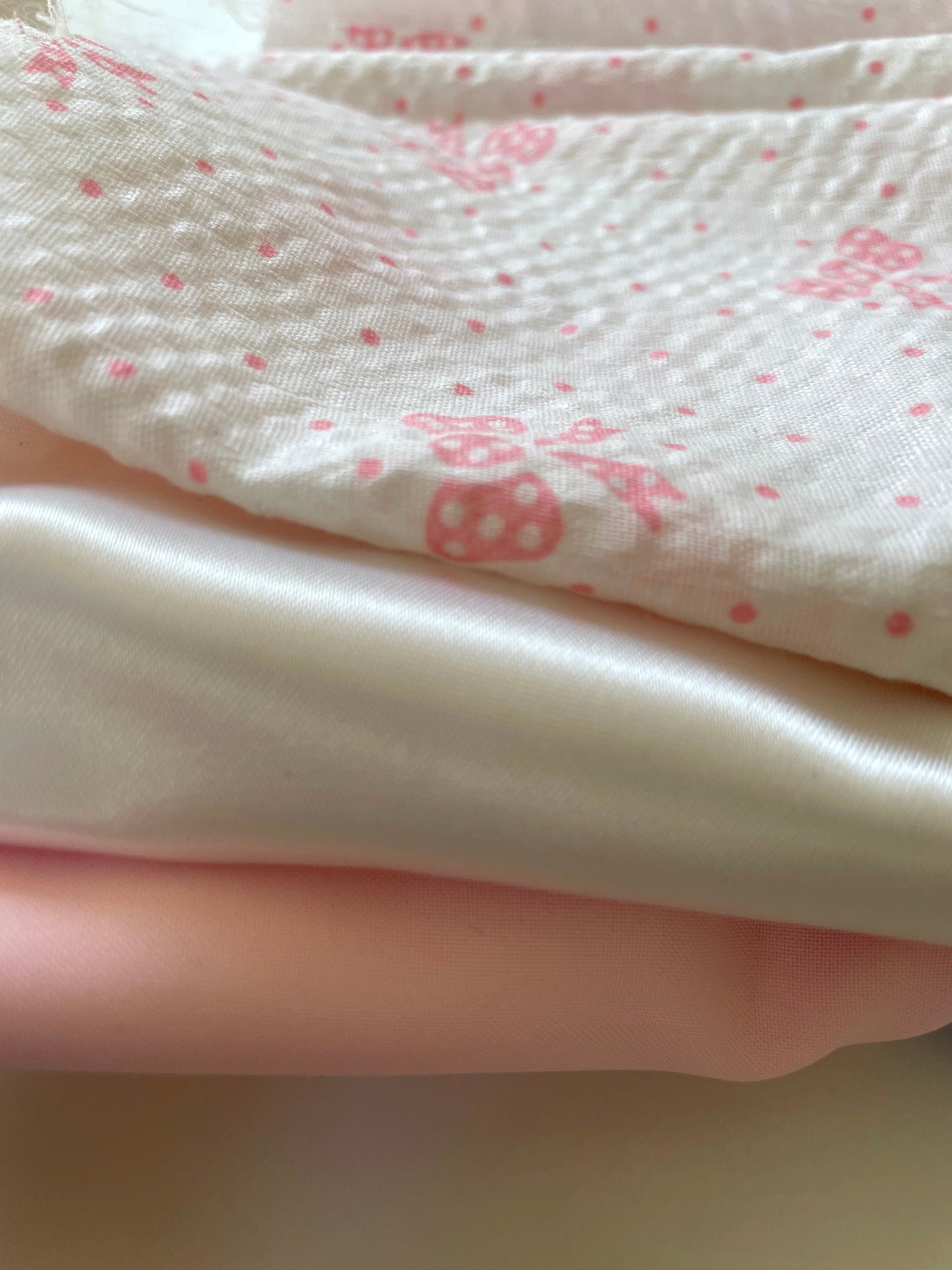 Lot of vintage fabric remnants - pink satin, white satin and white with pink bows