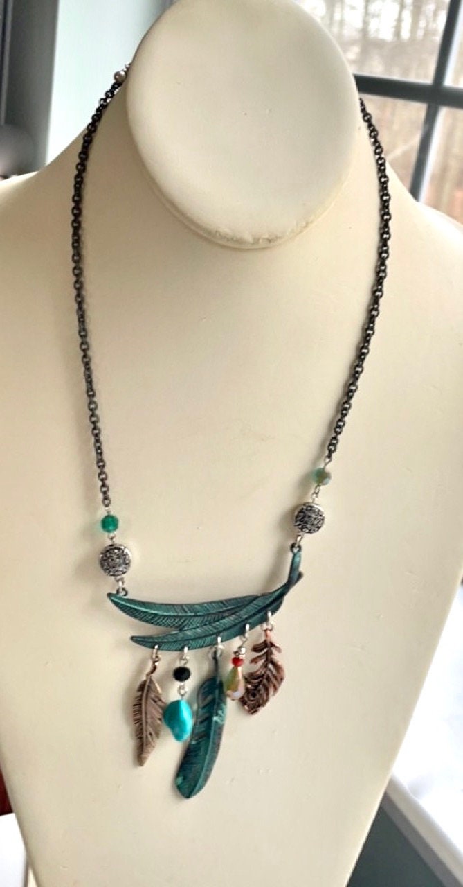 Mixed material feather and charm vintage artisan necklace