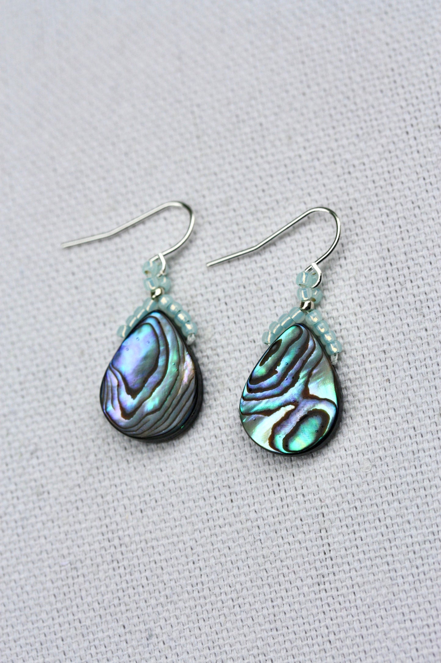 Beaded abalone shell teardrop shaped dangle earrings with sterling silver ear wires