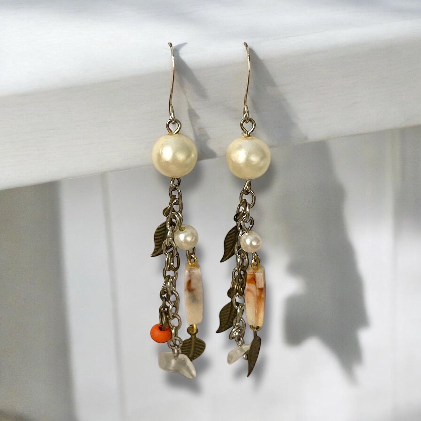 Collage inspired earrings - mixed materials including vintage metal leaves, orange wood, chain, faux pearls and ivory faux bone spacers