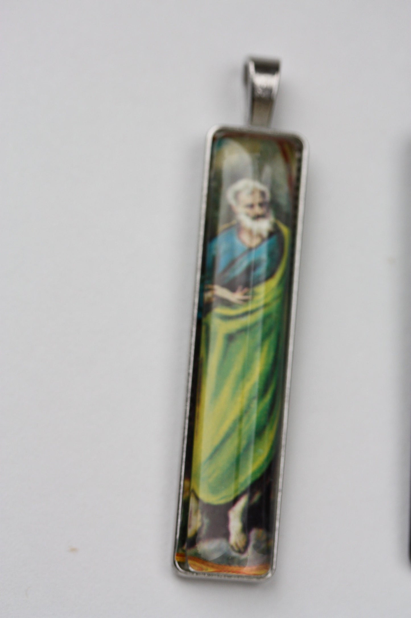 Necklace pendants made from genuine vintage and antique postage stamps from around the world - saints, Australian plane, Wicca  sun and moon