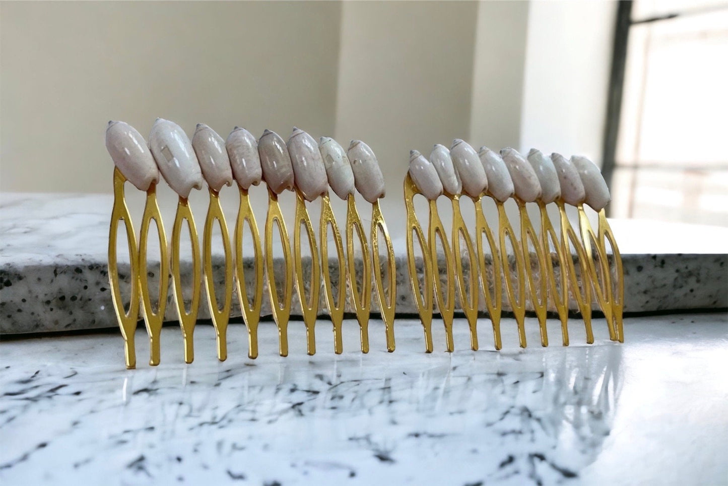 Stunning goldtone hair comb with white shells
