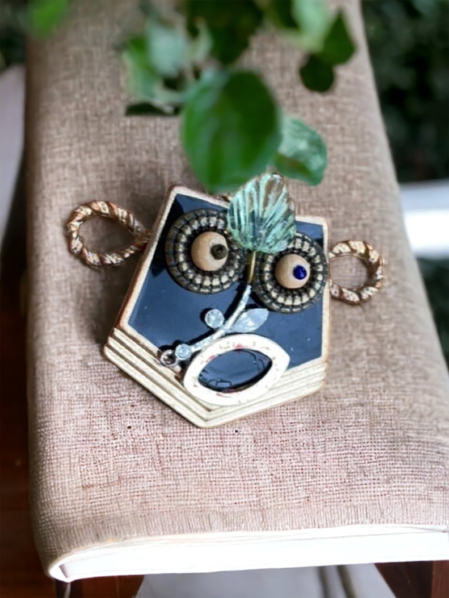 This monkey is a really cool assemblage art piece - it can be transformed into a necklace pendant, pin, magnet, small ornament or ring