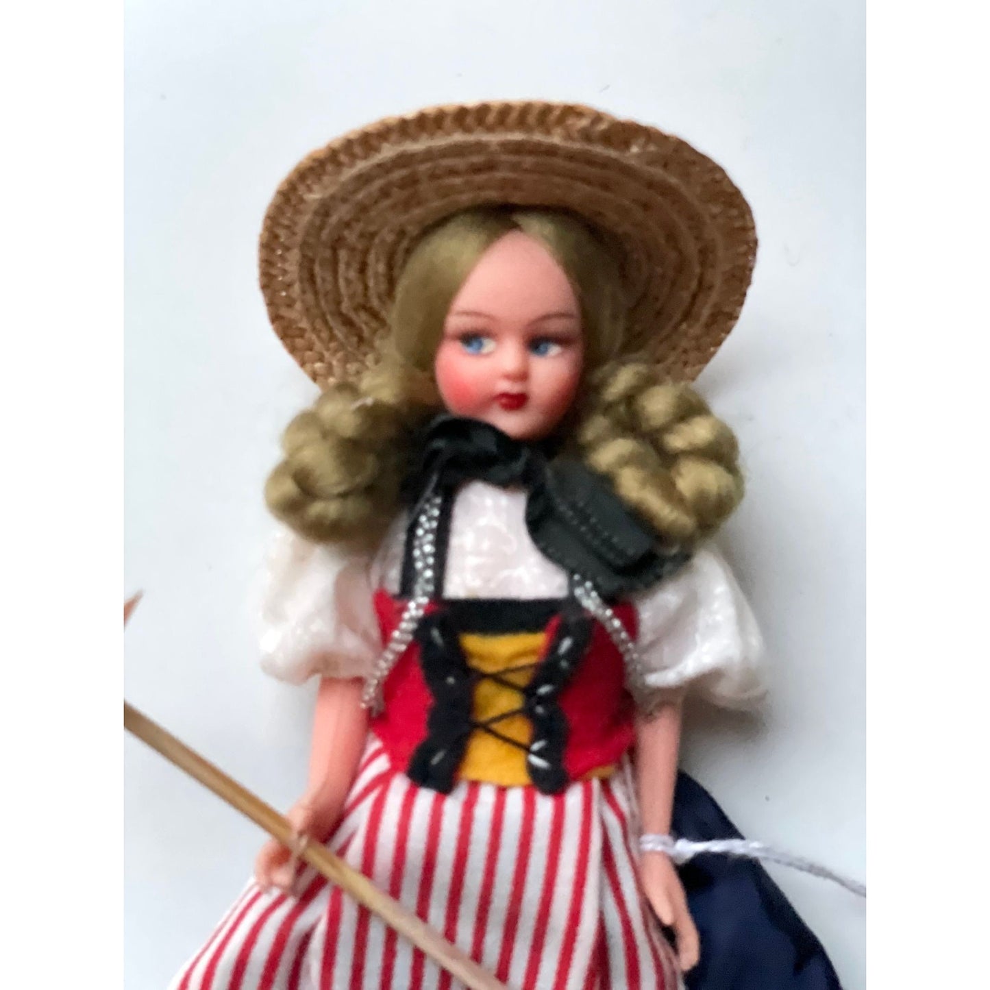 Vintage collectible handmade doll from Luganos Switzerland - with traditional handmade clothing and wooden rake