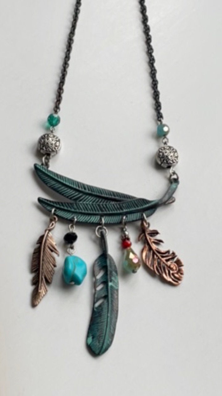 Mixed material feather and charm vintage artisan necklace