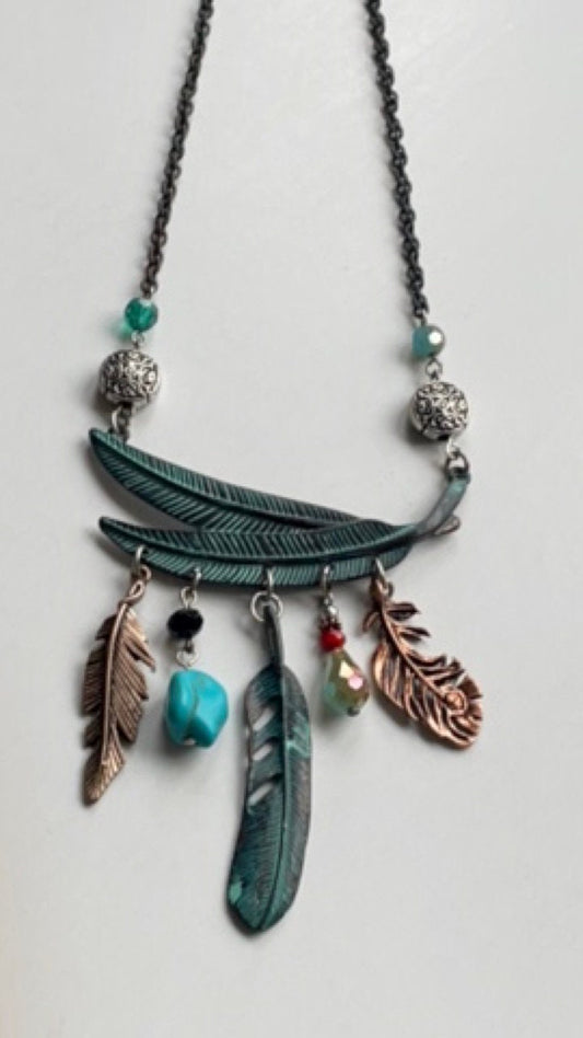 Mixed material feather and charm vintage artisan necklace