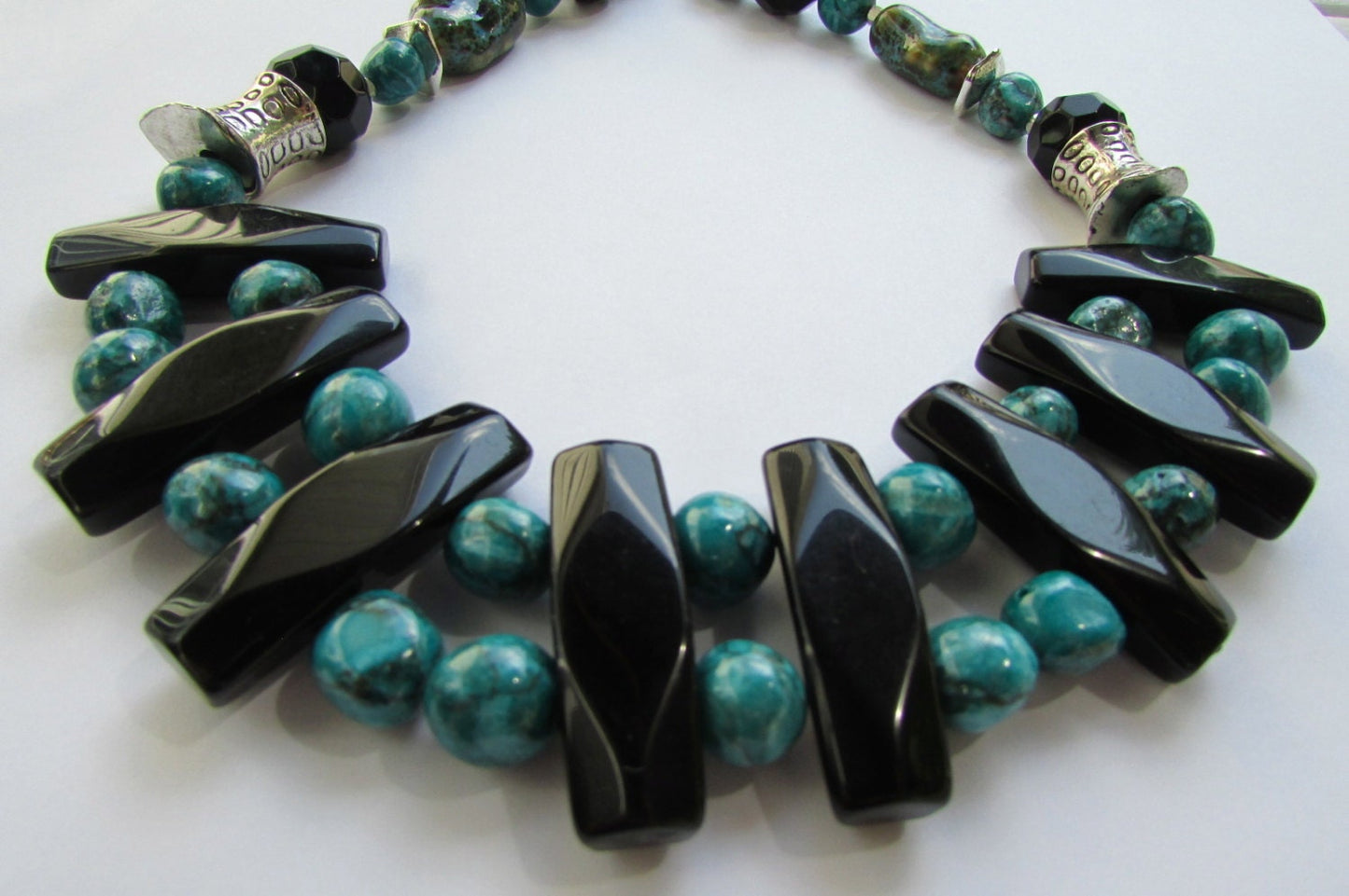Mixed material beaded necklace - porcelain, metal, plastic, glass - shades of turquoise & black