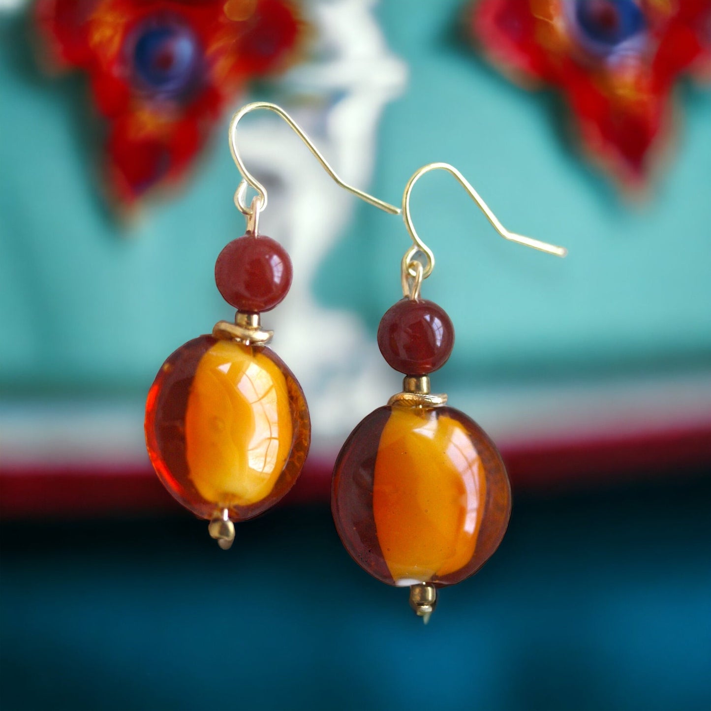 Orange and deep red dangle earrings