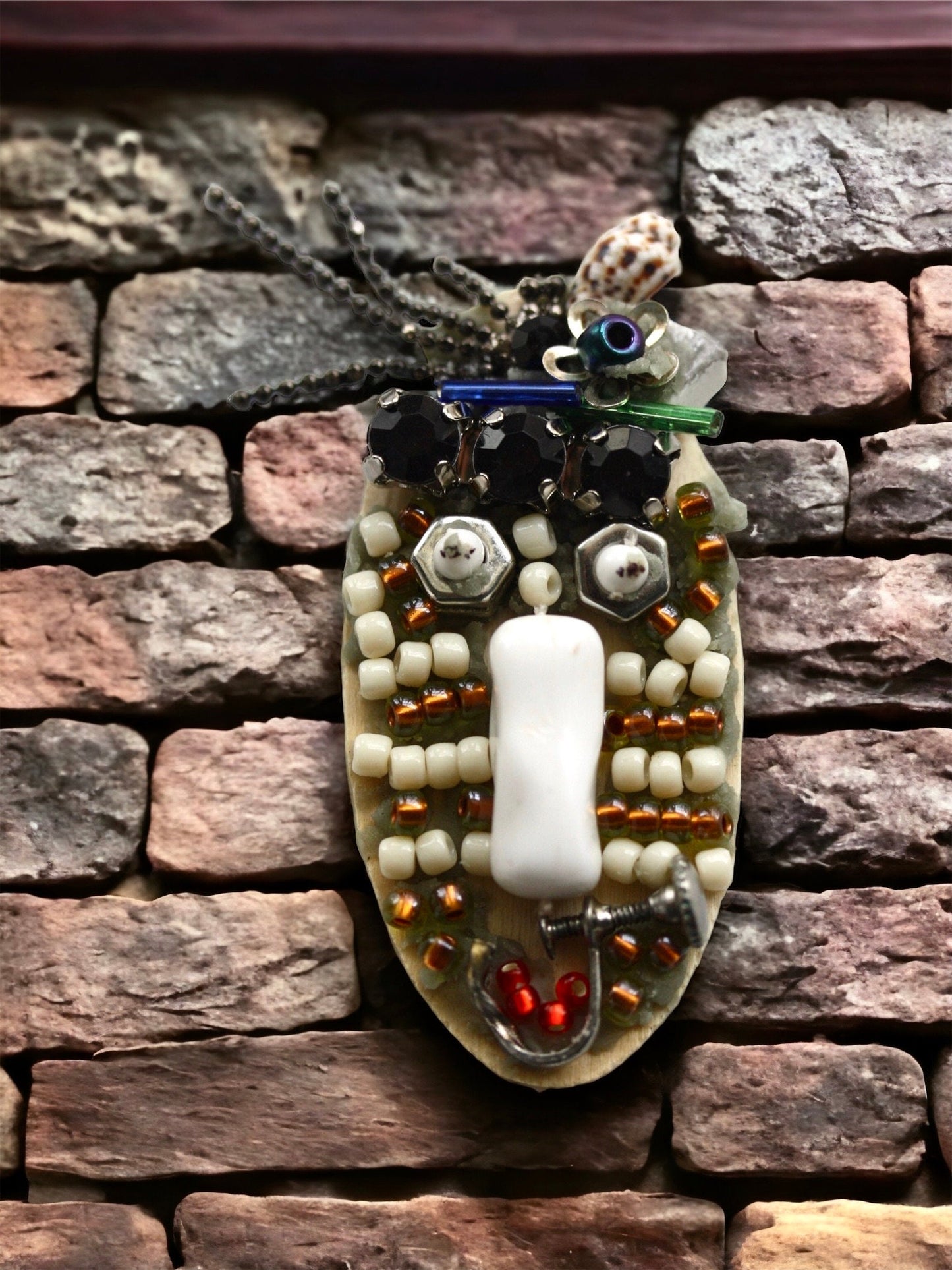 Meet "Sabina."  Sabina is a really cool assemblage art gal who can be transformed into a necklace, pin or magnet