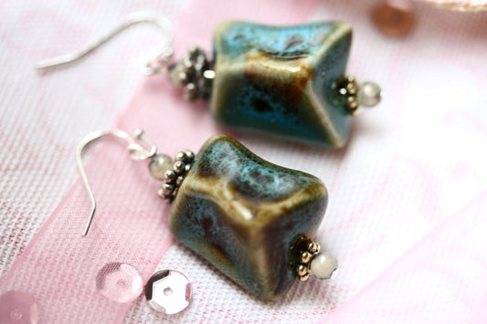 Handmade dangle earrings made with uniquely shaped faux turquoise beads