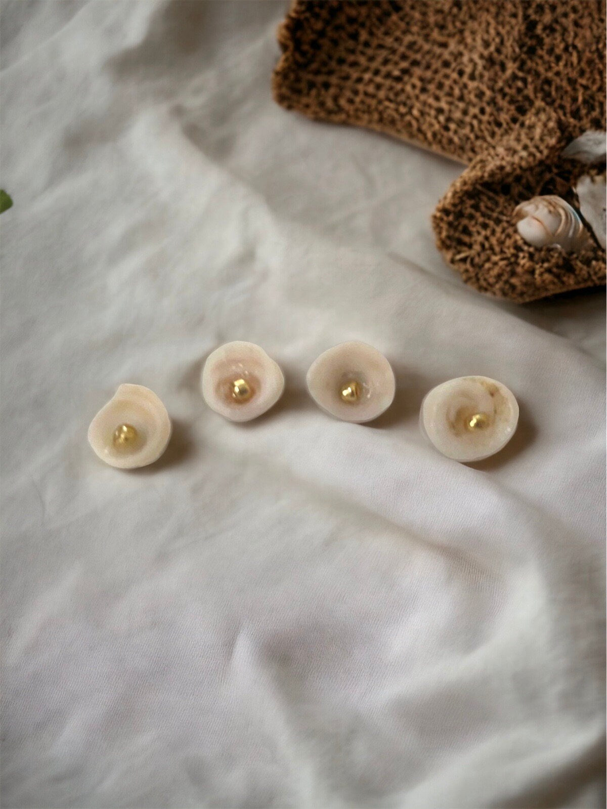 Ivory white shell stud earrings with goldtone centers