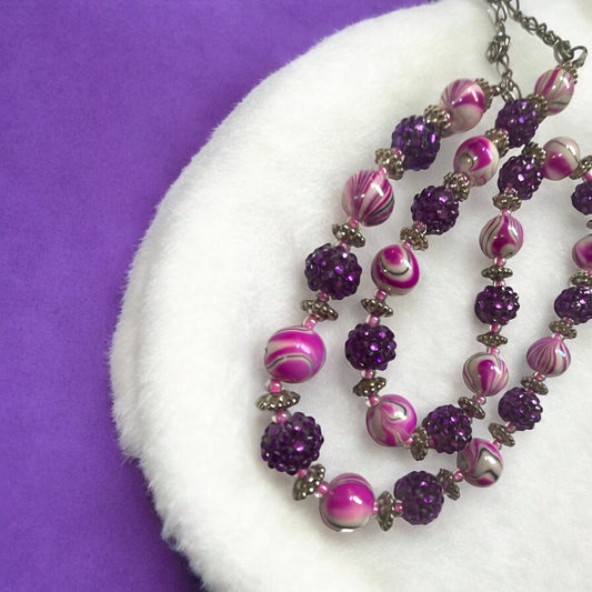 Shades of pinkish purple swirled vintage necklace with purple rhinestone beaded balls