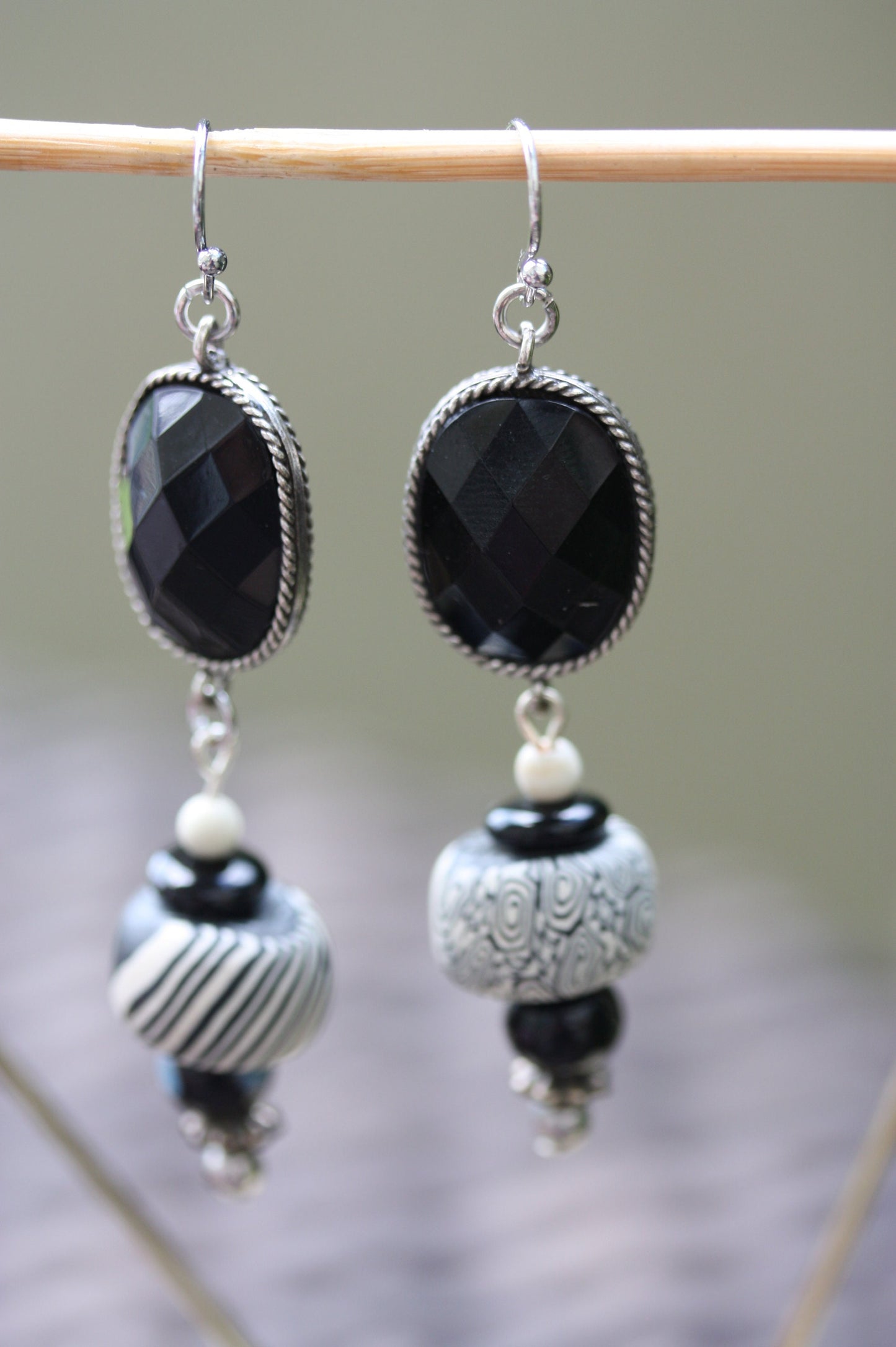 Black and white mixed media earrings made of upcycled polymer clay, combined with vintage black faux crystal, metal and glass spacer beads