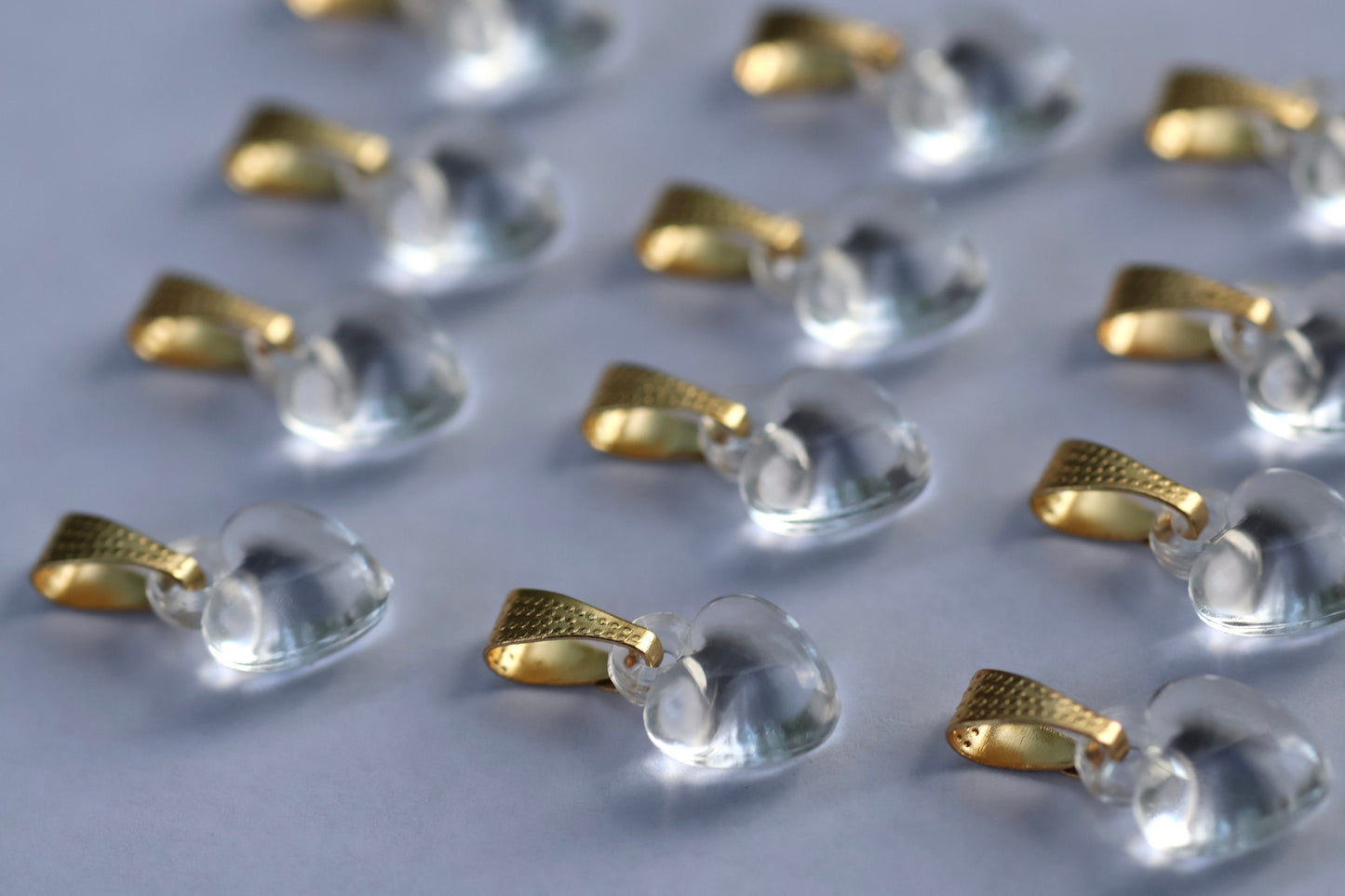 One dozen clear heart pendants - can be used as necklace pendants or for making earrings