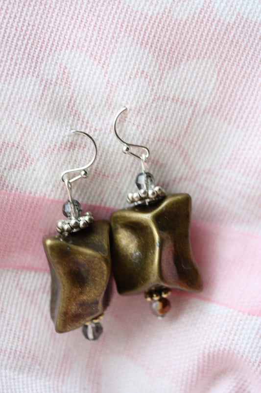 Handmade dangle earrings made with uniquely shaped faux stone beads