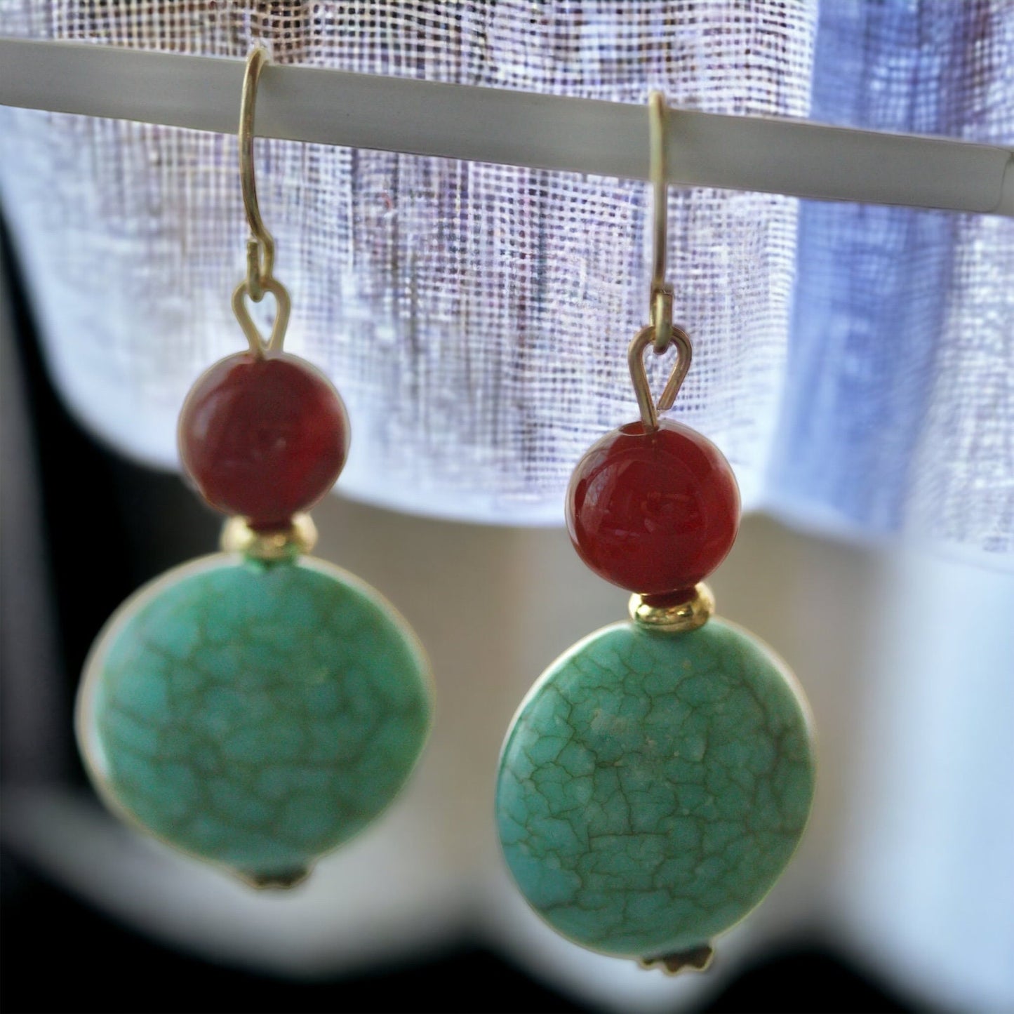 Dangle earrings made of faux turquoise and deep red glass