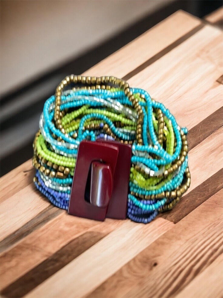 Stunning vintage bracelet - loaded with dozens of strands of tiny glass beads - plastic or bakelite closure?