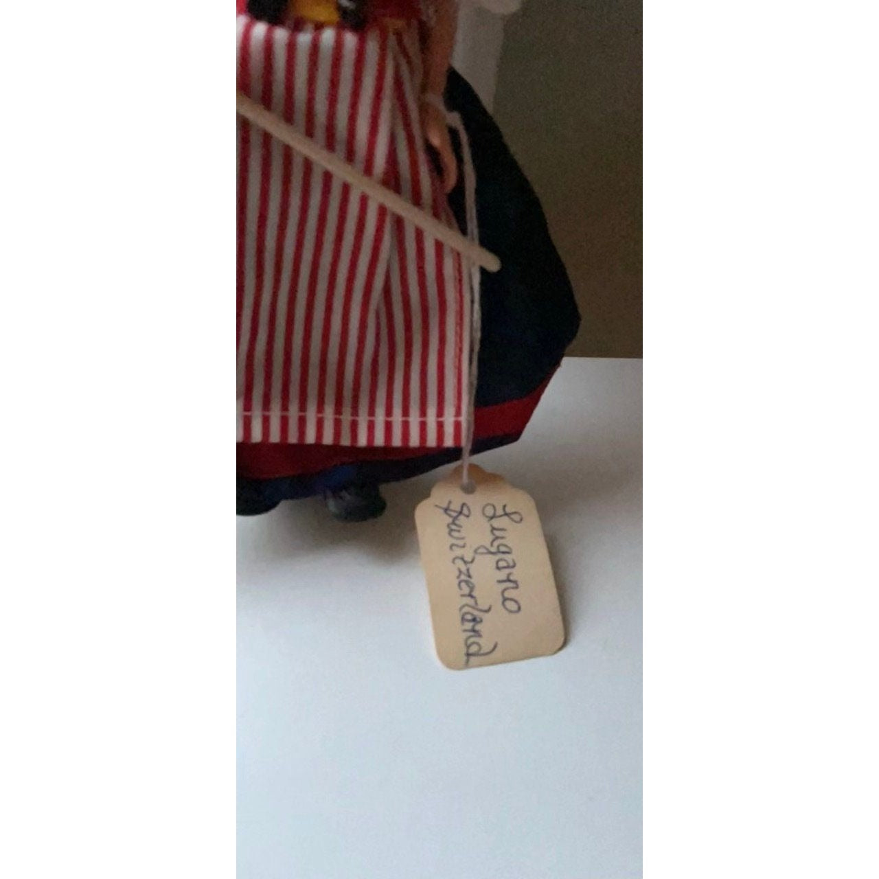 Vintage collectible handmade doll from Luganos Switzerland - with traditional handmade clothing and wooden rake