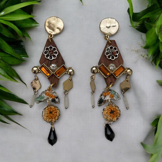 Mixed media earrings made with embroidery from a vintage linen table runner,  rosary wood, hammered metal, glass tubes, orange rhinestones