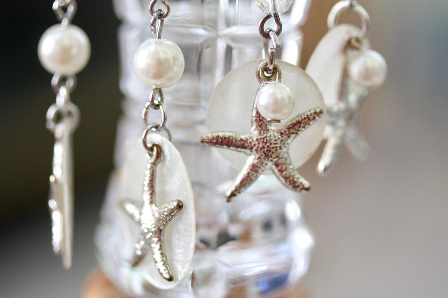 Capiz shell, faux pearl and silvertone starfish beach themed dangle earrings