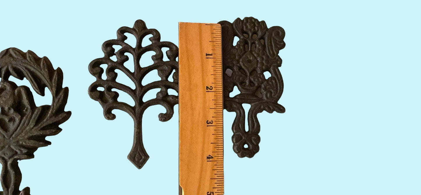 Set of 4 small cast iron trivets - vintage or antique?
