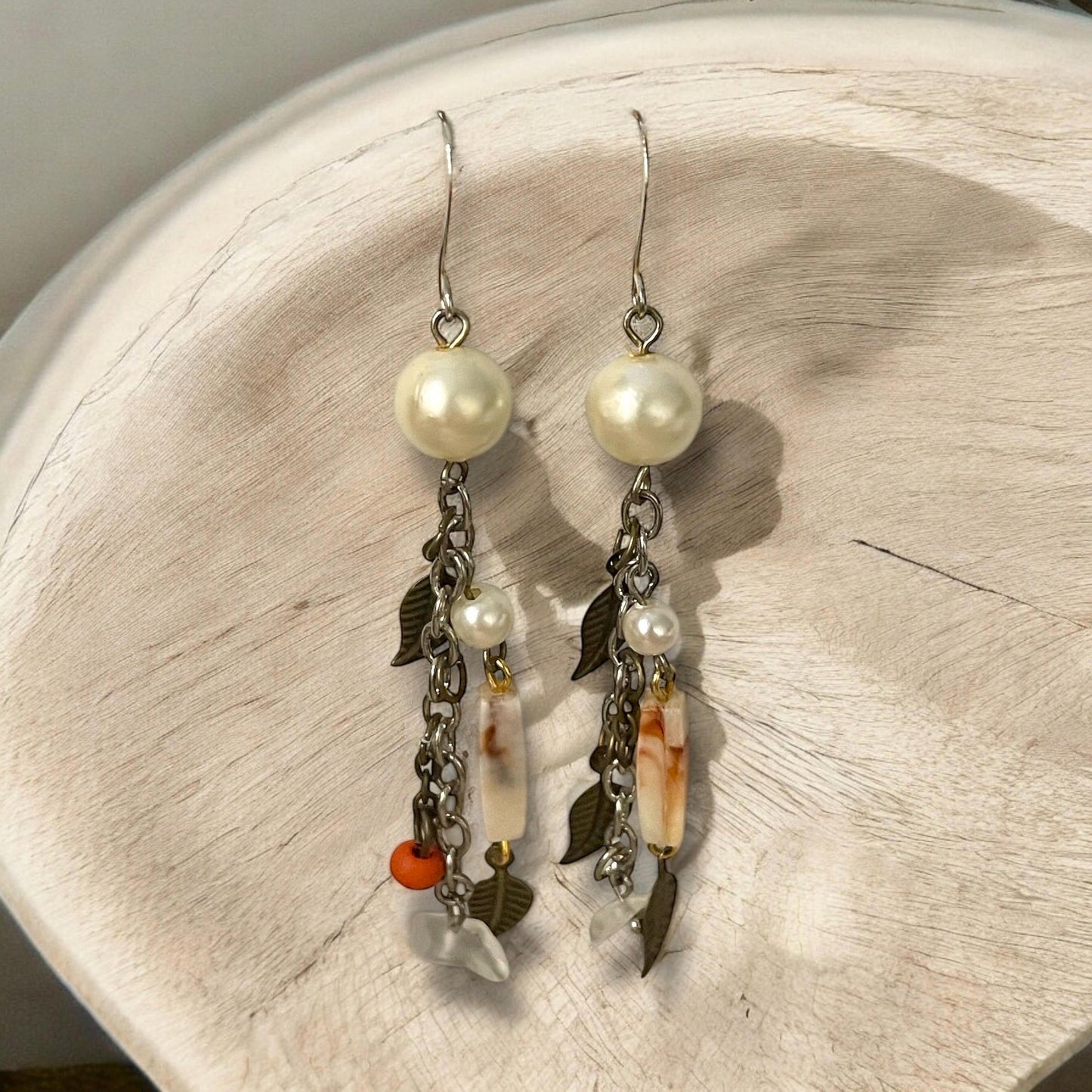Collage inspired earrings - mixed materials including vintage metal leaves, orange wood, chain, faux pearls and ivory faux bone spacers