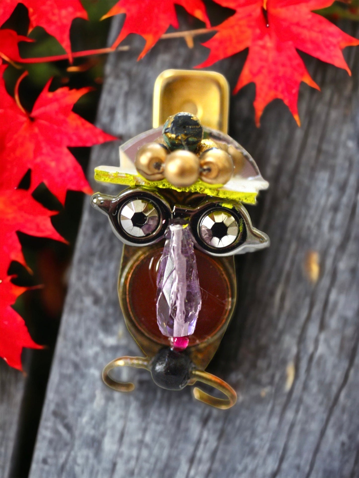 Meet "Henrietta."  Henrietta is a really cool assemblage art gal who can be transformed into a necklace, pin, magnet, bottle or little dish