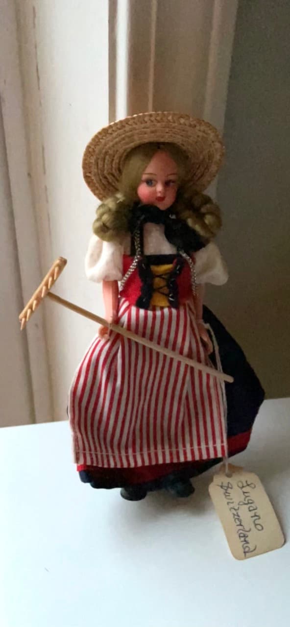 Vintage collectible handmade doll from Luganos Switzerland - with traditional handmade clothing and wooden rake
