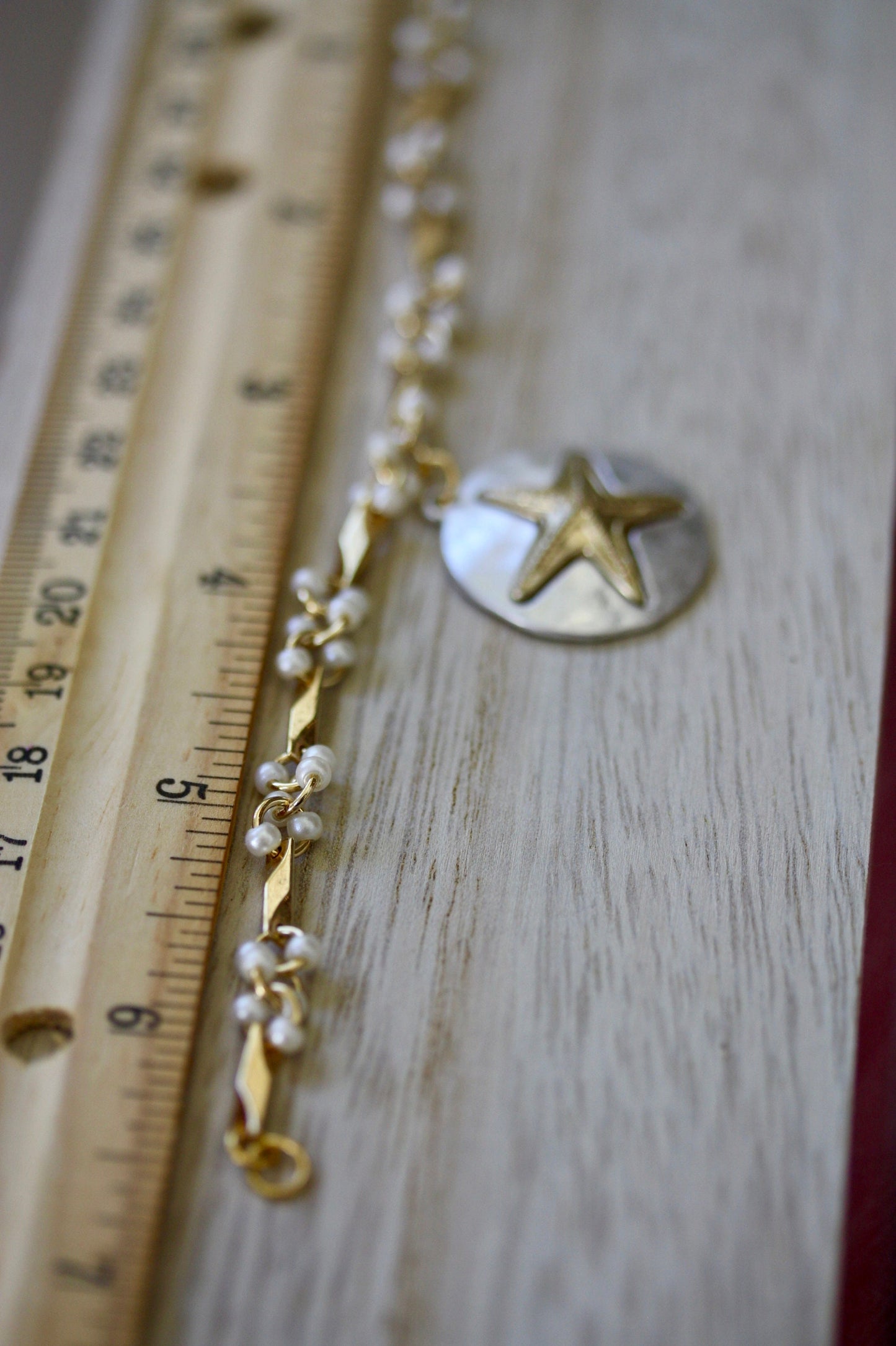 Handmade bracelet made with upcycled / repurposed vintage silver tone and gold tone starfish dangle, charm bracelet