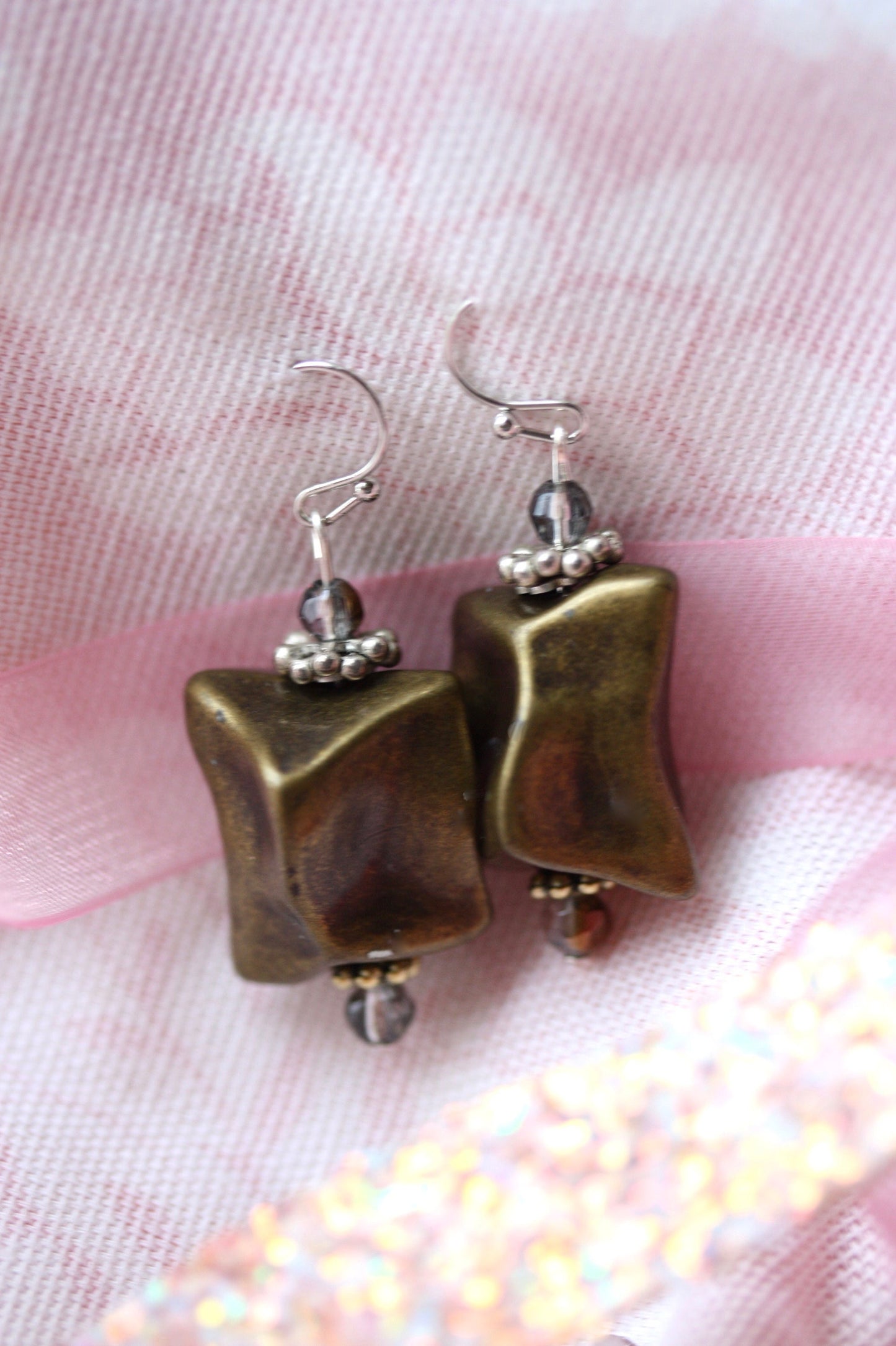 Handmade dangle earrings made with uniquely shaped faux stone beads