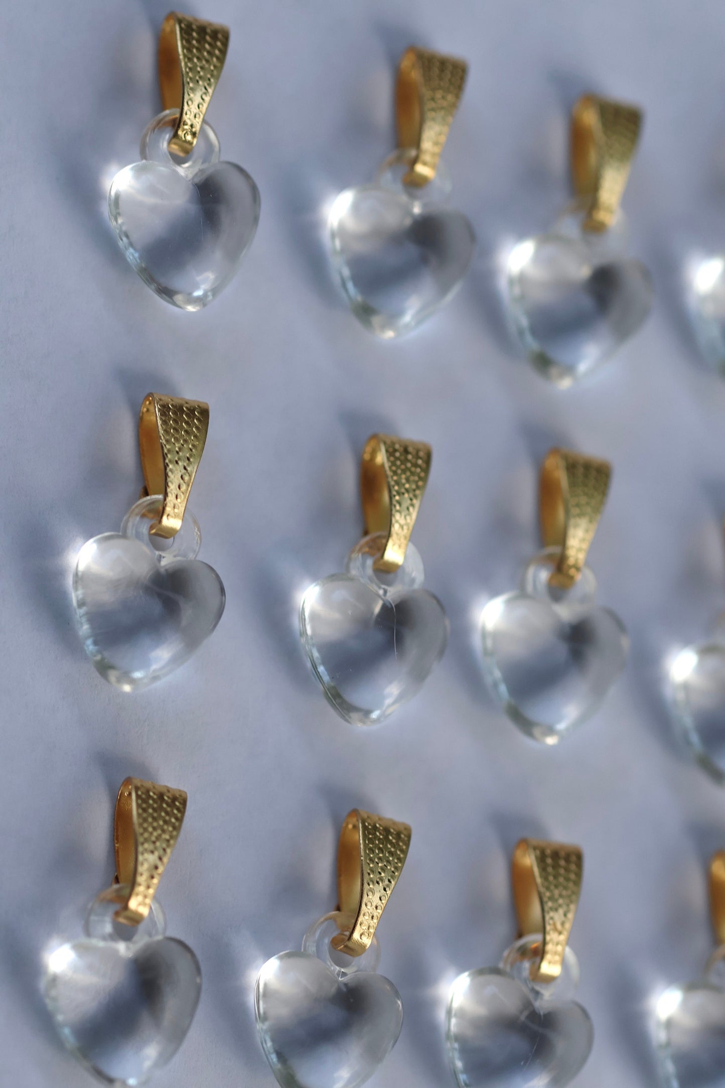One dozen clear heart pendants - can be used as necklace pendants or for making earrings