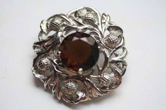 Stunning vintage pin with faceted center
