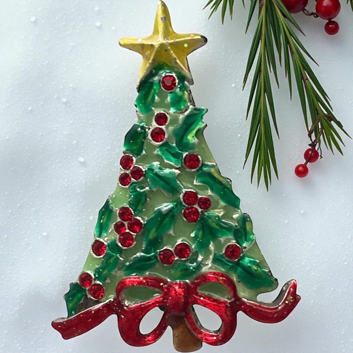 AJMC Christmas Tree Pin • Vintage Enamel Holiday Brooch with Red Rhinestones & Star Topper
