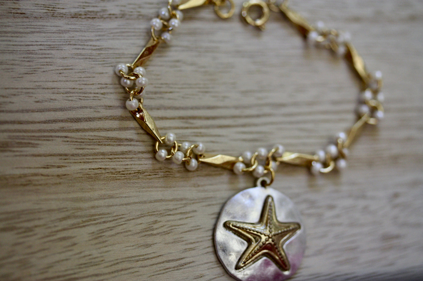 Handmade bracelet made with upcycled / repurposed vintage silver tone and gold tone starfish dangle, charm bracelet