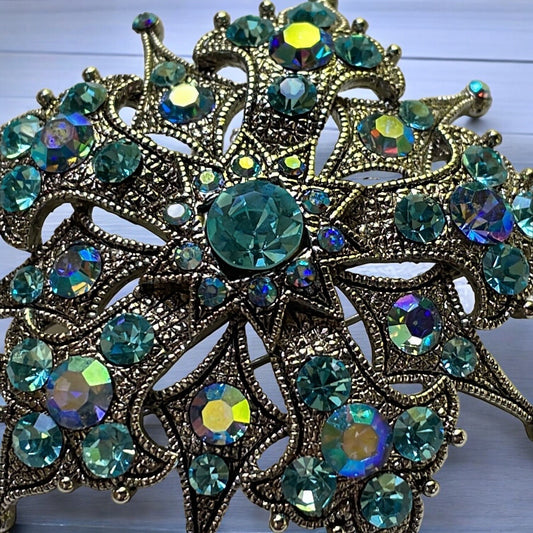 Magnificent vintage pin loaded with blue AB rhinestones