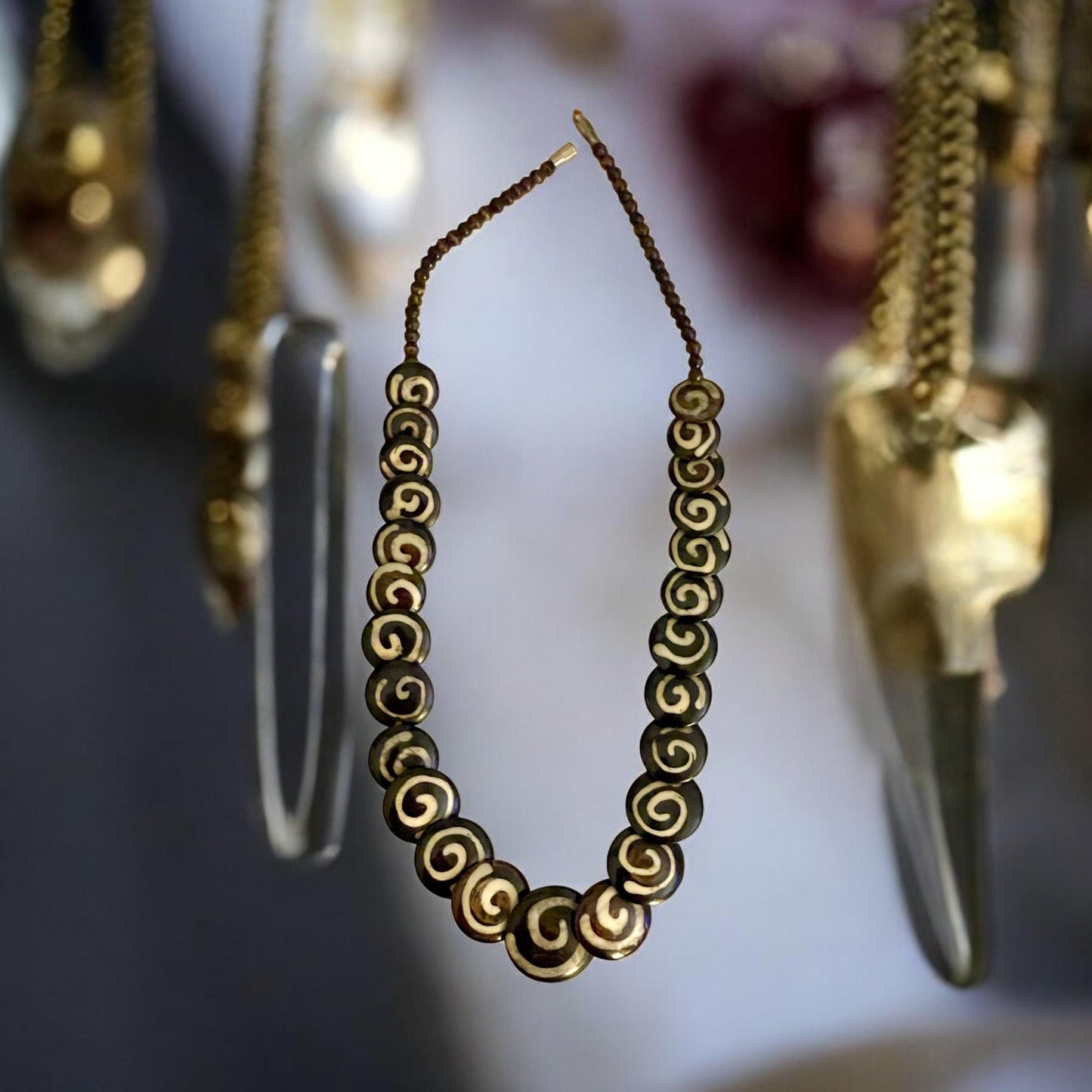 Tribal style vintage necklace - with beautiful swirled discs that are either bovine or wood?