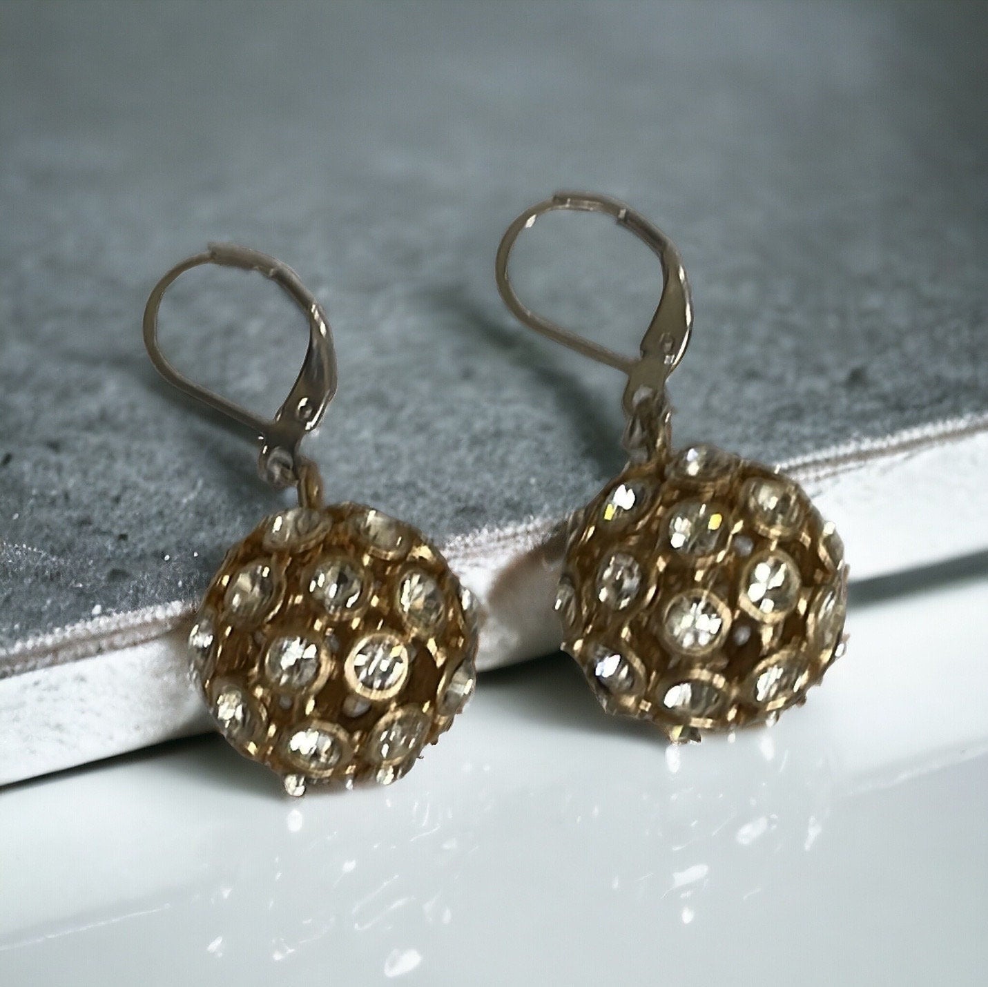 Inlaid rhinestone studded gold ball earrings