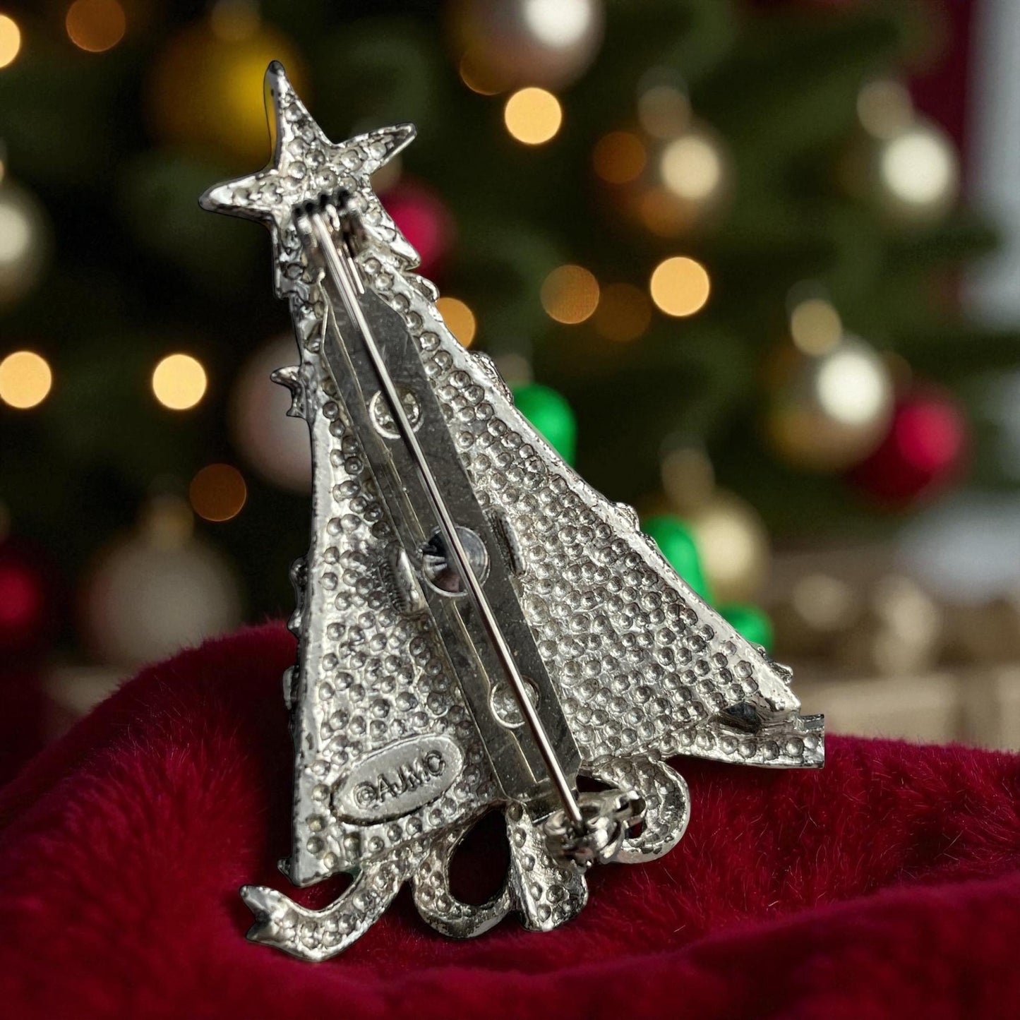 AJMC Christmas Tree Pin • Vintage Enamel Holiday Brooch with Red Rhinestones & Star Topper