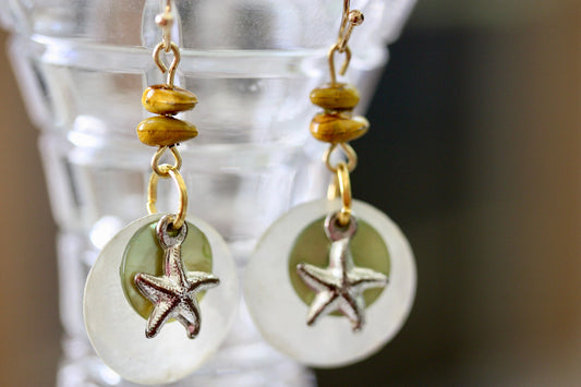 Mixed materials - green mother of pearl, metal starfish and yellow wood - beach themed dangle earrings