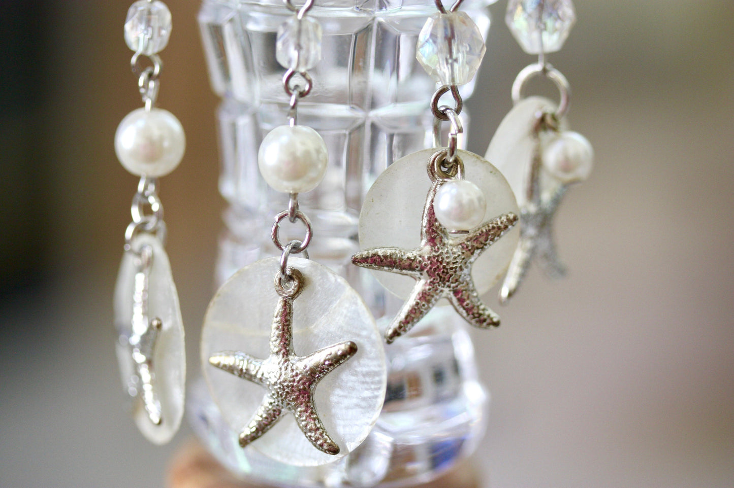 Capiz shell, faux pearl and silvertone starfish beach themed dangle earrings
