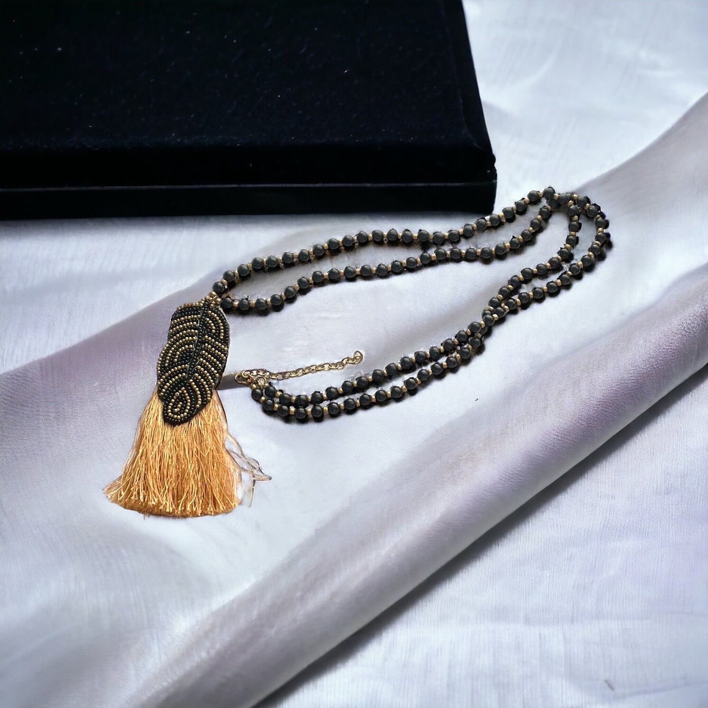 Stunning and unique hand beaded vintage artisan black and gold tassel necklace