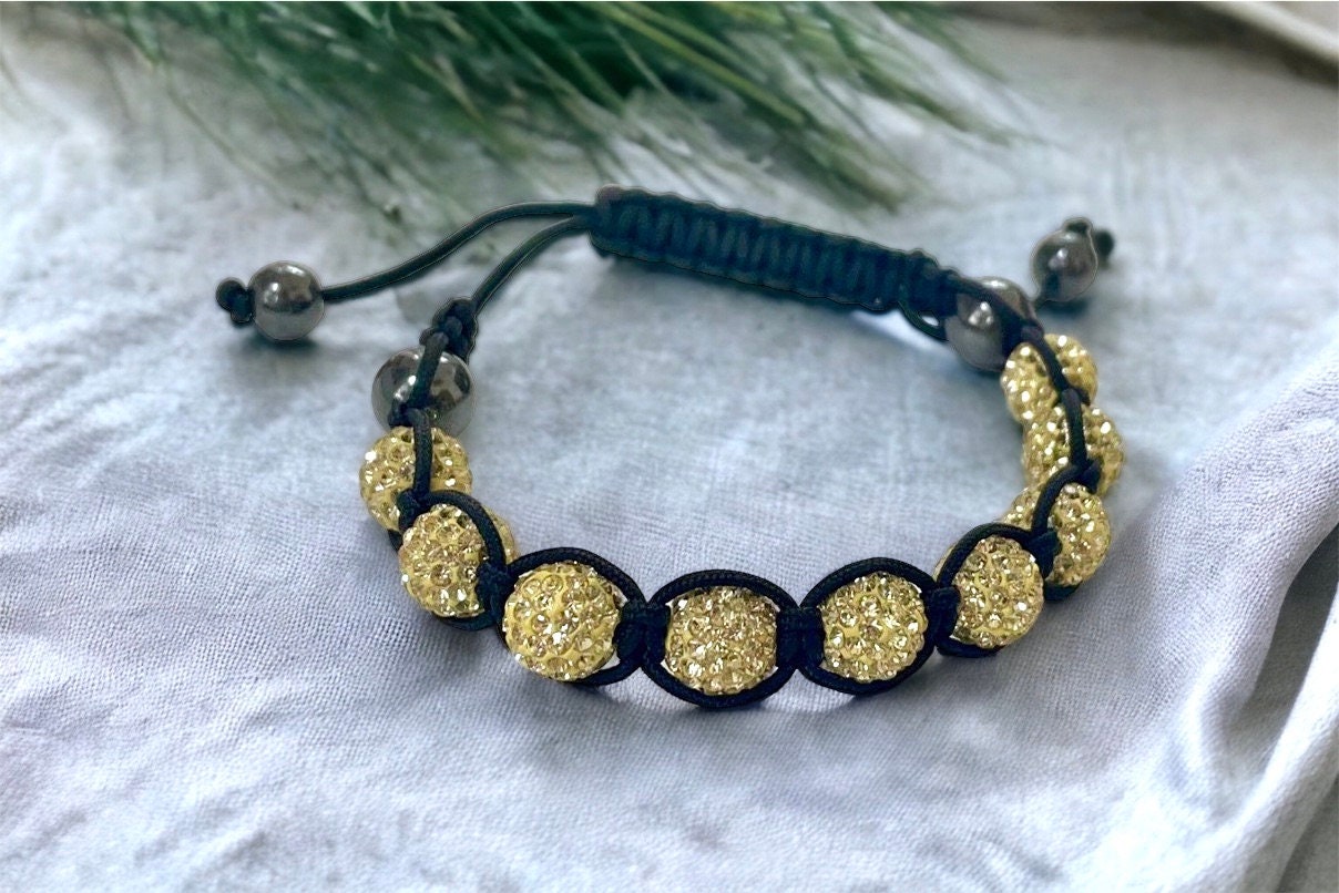 Sparkly black and yellow goldtone bracelet with hematite beads - adjustable