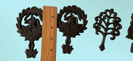 Set of 4 small cast iron trivets - vintage or antique?