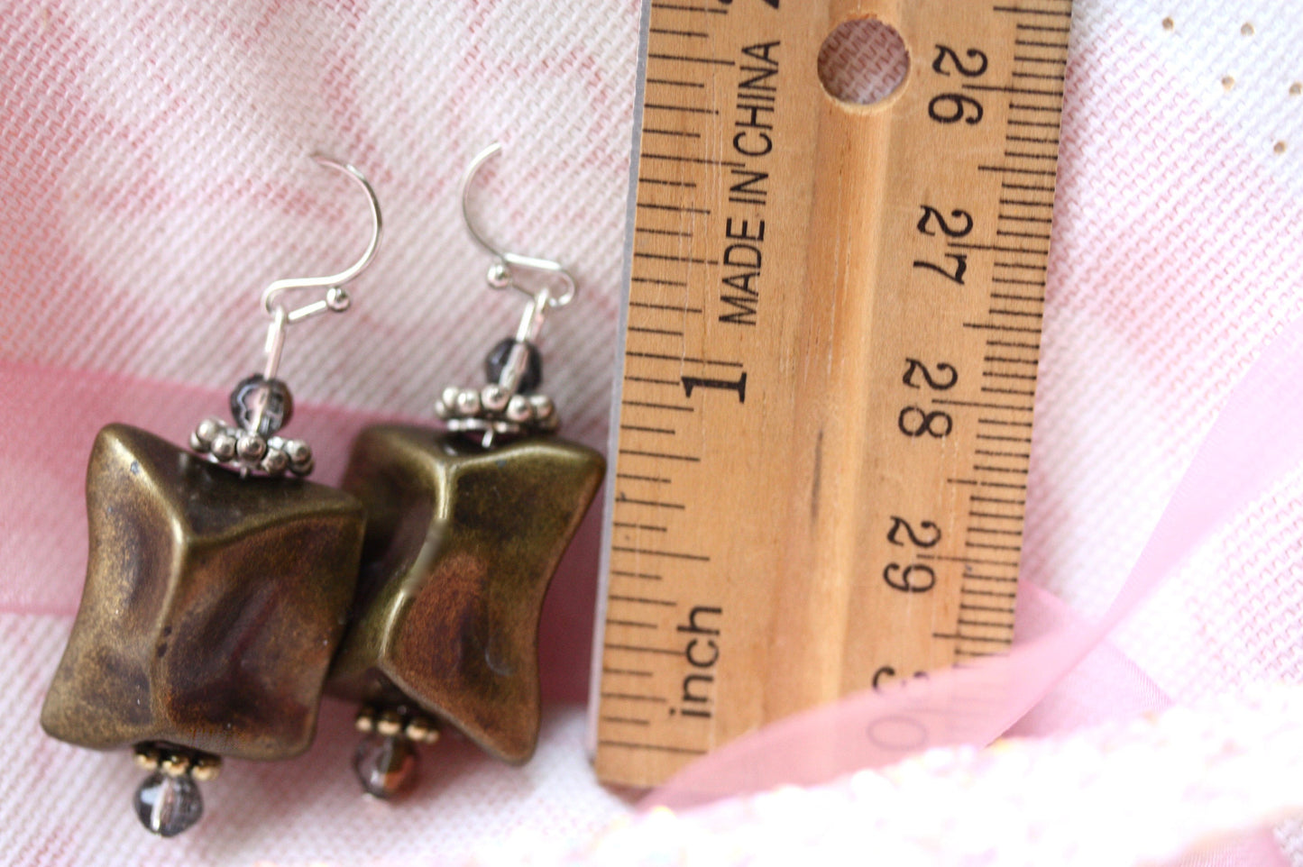 Handmade dangle earrings made with uniquely shaped faux stone beads