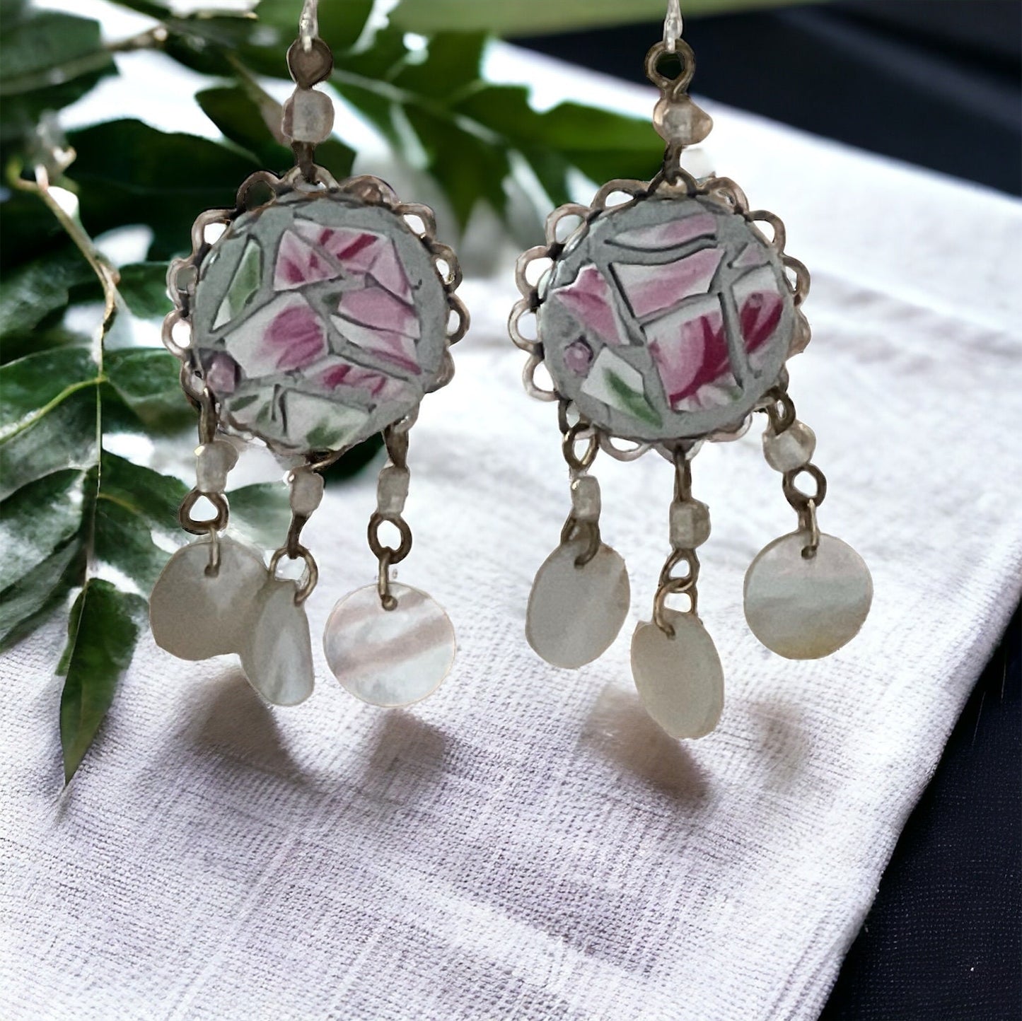 Unique earrings made of hand cut mosaic tile from vintage plates combined with mother of pearl dangles
