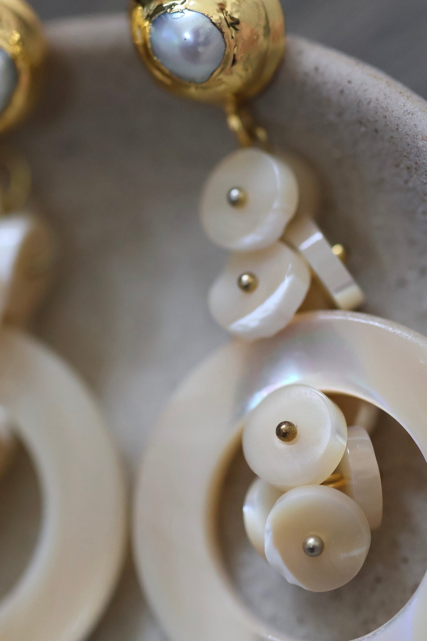 Very unique cream colored mother of pearl shell rounded hoop dangle earrings