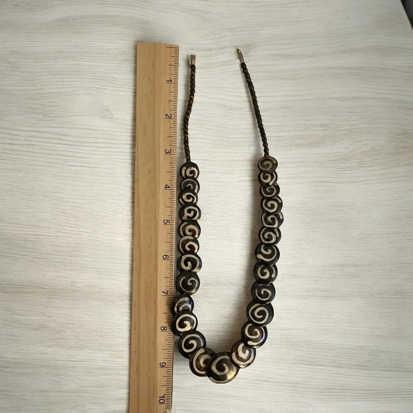 Tribal style vintage necklace - with beautiful swirled discs that are either bovine or wood?