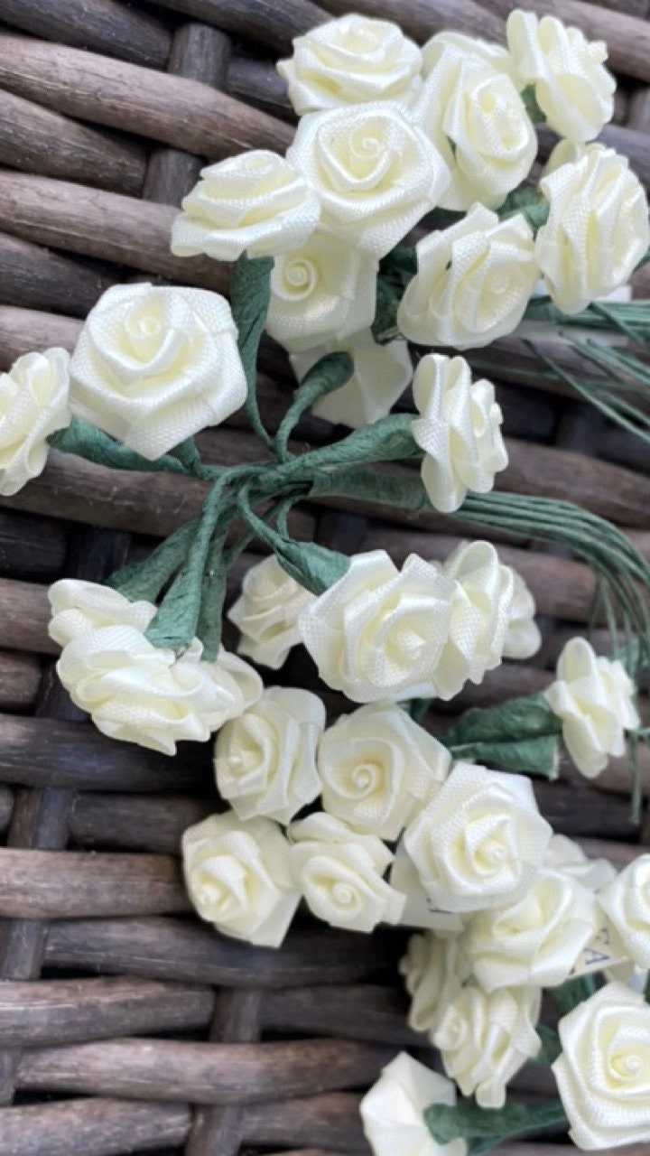 Three dozen individually wire stemmed faux flowers - available in 3 colors - yellow, cream or white