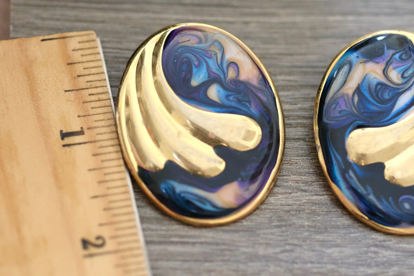 Shades of blue swirled vintage earrings with curved goldtone inlay